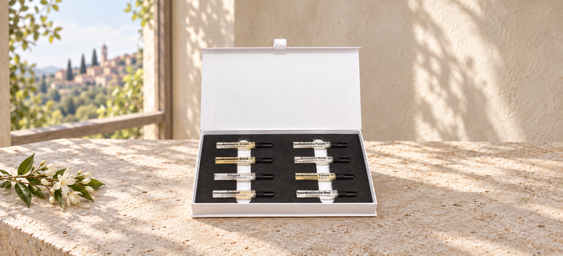 Discovery Set II with eight perfume miniatures on limestone beside jasmine in soft window light